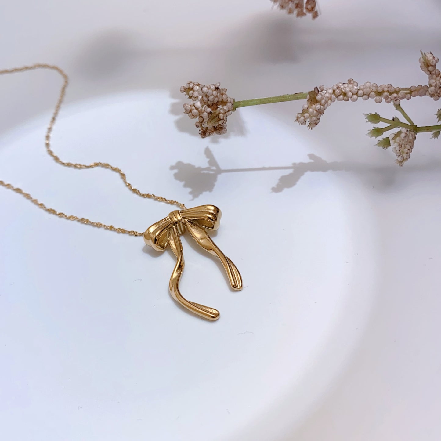 Twisted Bow Pendant Necklace