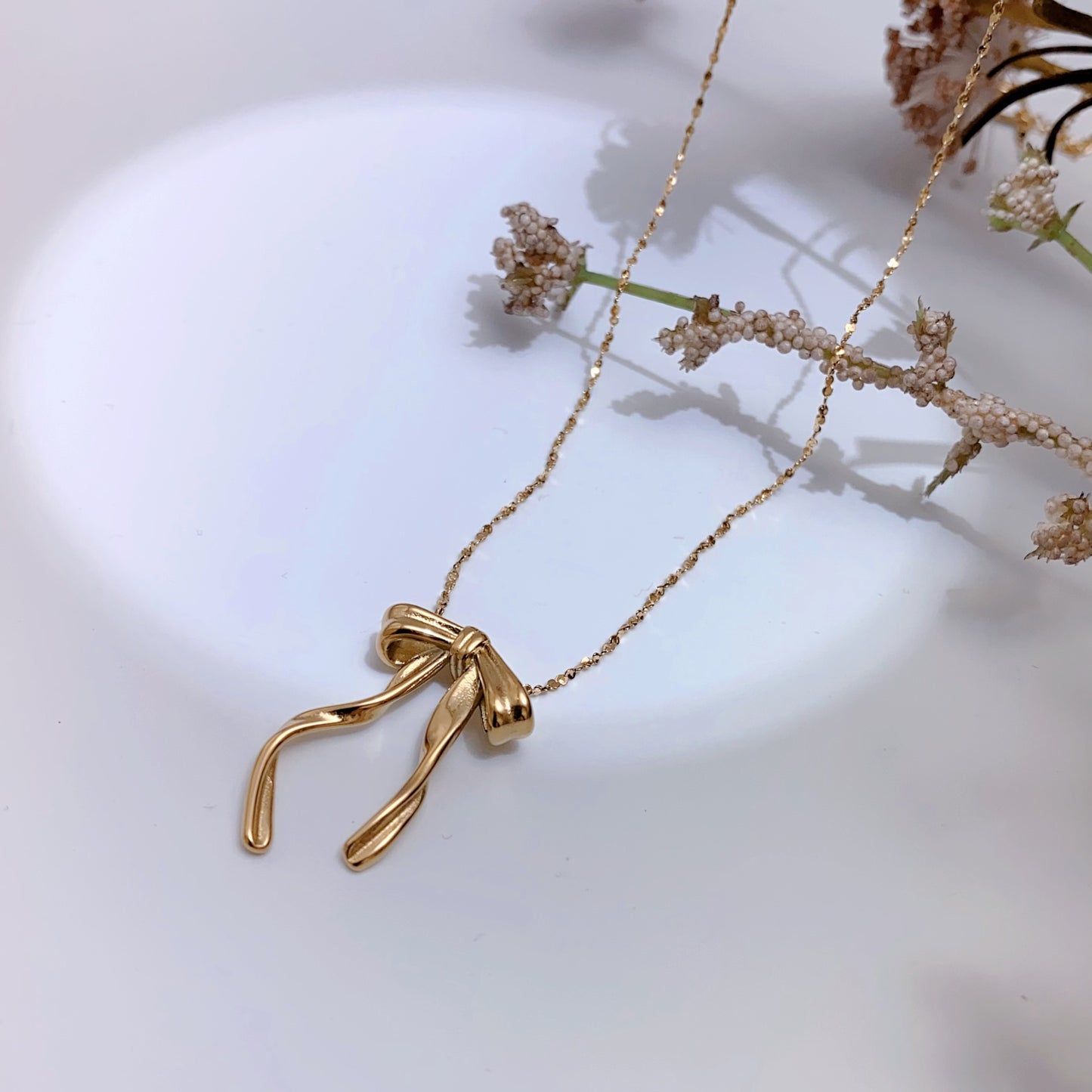 Twisted Bow Pendant Necklace